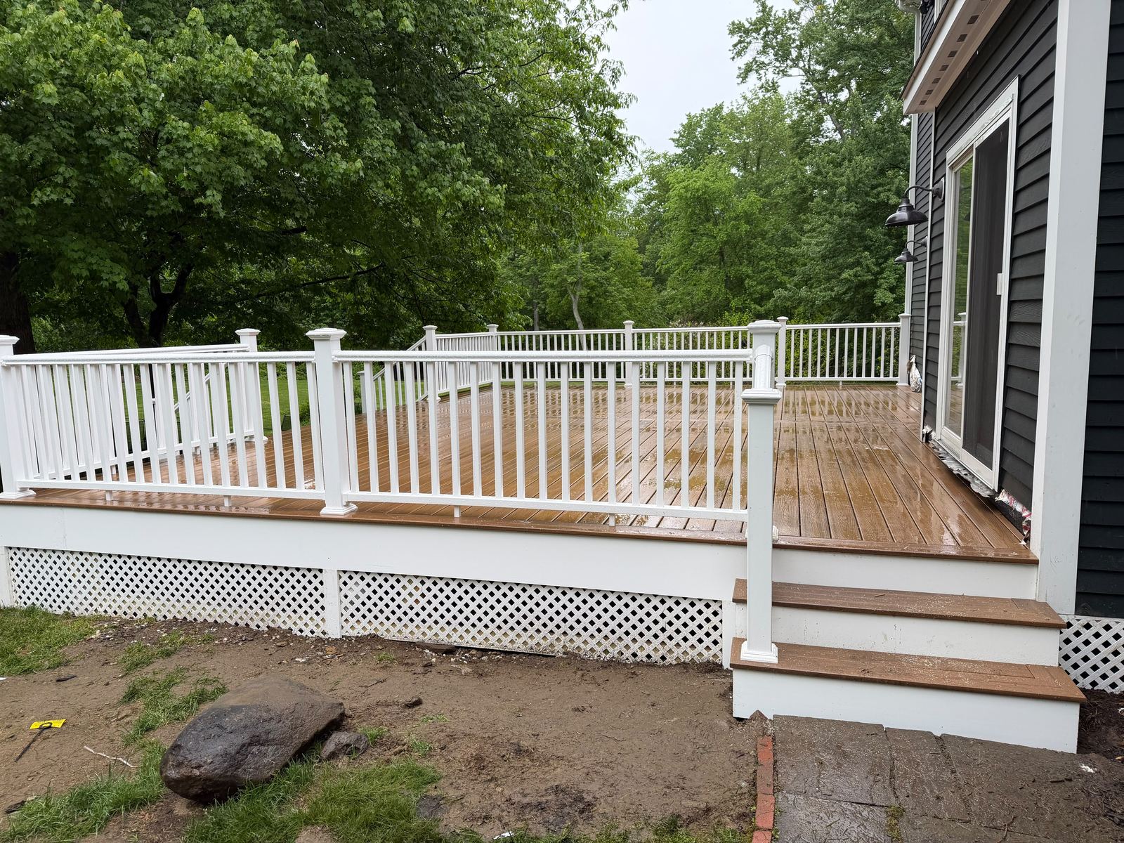 Completed deck with white railing in Danbury, CT