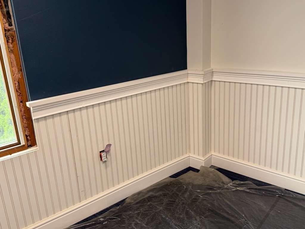 Wainscoting and trim installation in progress